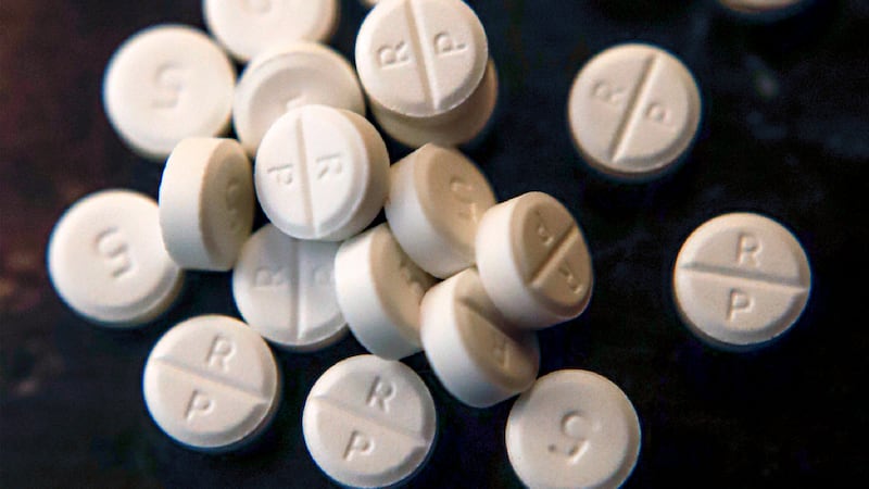 FILE - Several 5-mg pills of Oxycodone are seen June 17, 2019, in Zelienople, Pa.